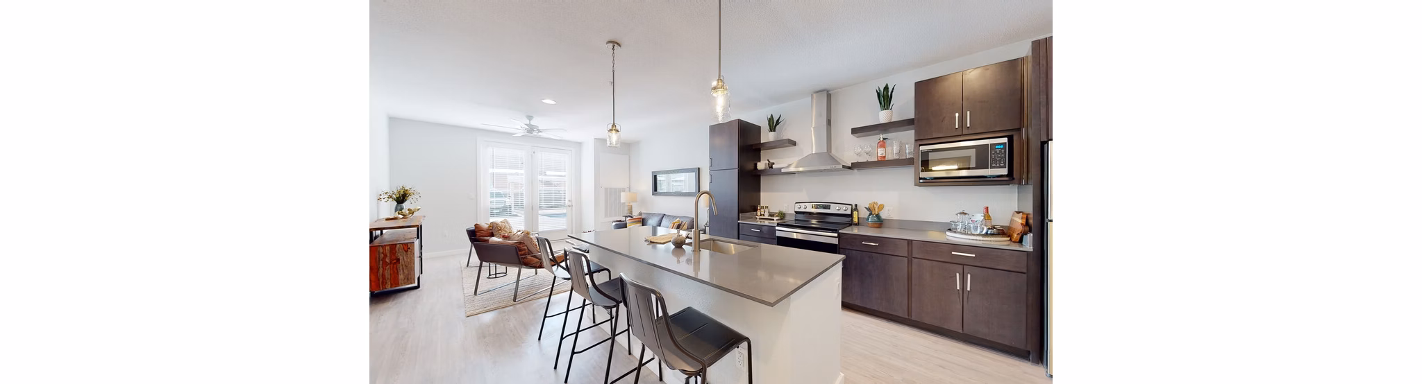 Modern kitchen with stainless steel appliances at FLATZ 602 Apartments