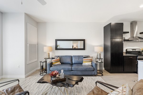 Modern living room with sleek furniture at FLATZ 602 Apartments, ideal for luxurious city living