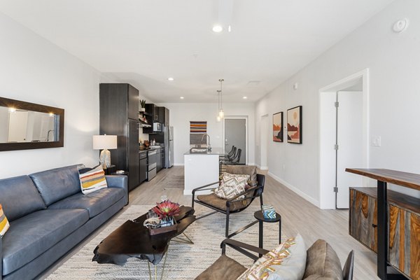 Modern living room with sleek furnishings at FLATZ 602 Apartments