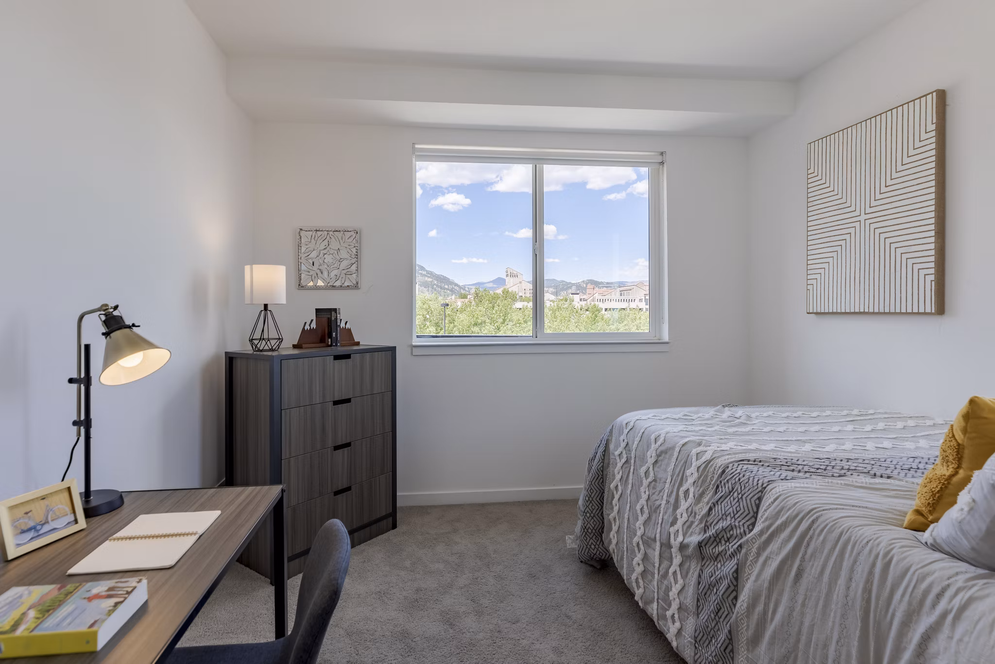Spacious bedroom with modern furnishings at Union 9Seventy Apartments