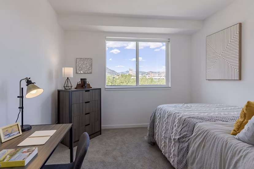 Spacious bedroom with modern furnishings at Union 9Seventy Apartments