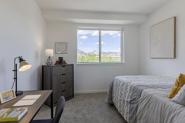 Spacious bedroom with modern furnishings at Union 9Seventy Apartments