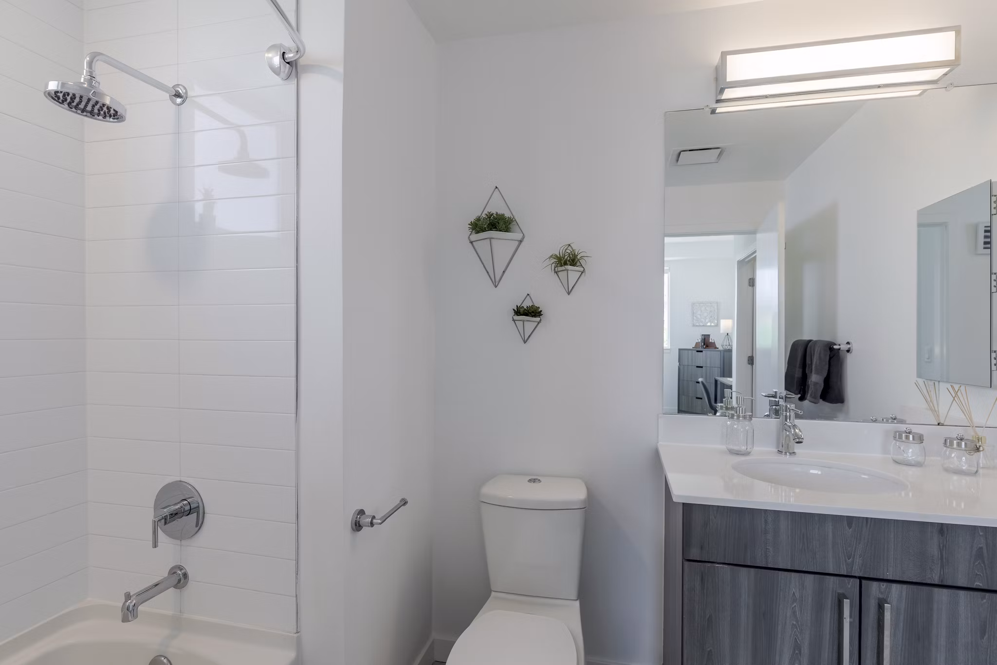 Modern bathroom featuring elegant fixtures and spacious design at Union 9Seventy Apartments