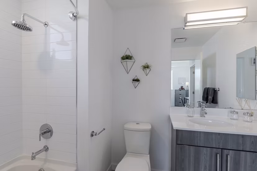 Modern bathroom featuring elegant fixtures and spacious design at Union 9Seventy Apartments