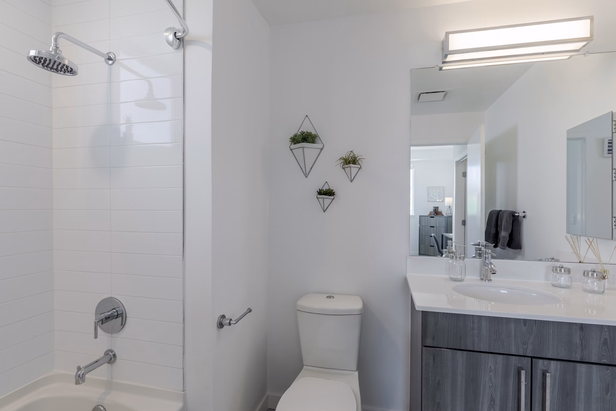 Modern bathroom featuring elegant fixtures and spacious design at Union 9Seventy Apartments