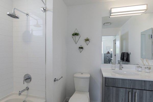 Modern bathroom featuring elegant fixtures and spacious design at Union 9Seventy Apartments