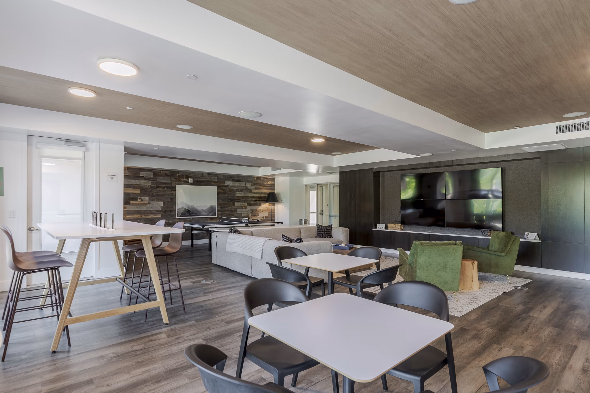 Clubhouse featuring modern seating and large windows at Union 9Seventy Apartments in Boulder