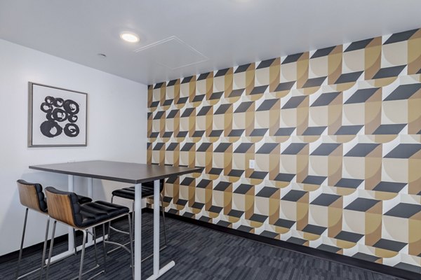 Elegantly designed clubhouse at Union 9Seventy Apartments featuring modern dÃ©cor and spacious seating areas