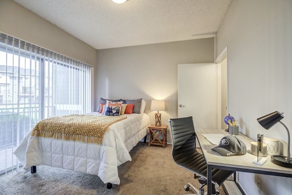 Bedroom with modern furnishings at Union Baseline Apartmentsï¼ï¼-a Greystar luxury apartment community