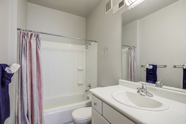 Modern bathroom with double vanity and sleek finishes at Union Baseline Apartments