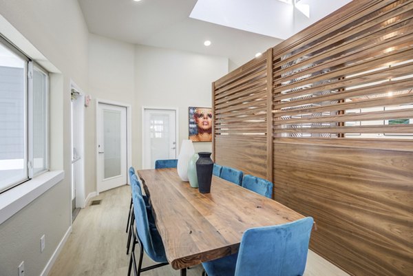 Modern clubhouse featuring spacious lounge and entertainment areas at Union Baseline Apartments