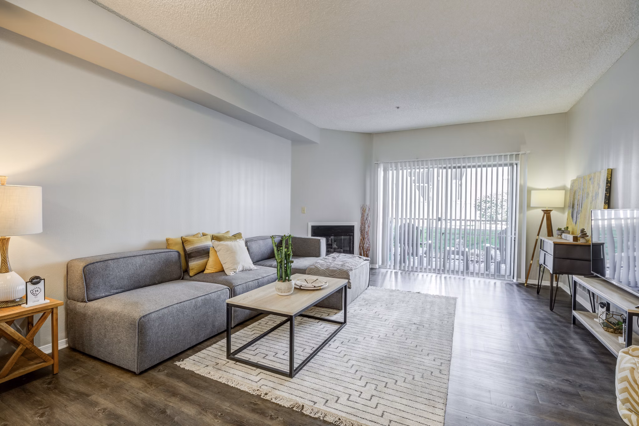 Spacious living room with modern furnishings at Union Baseline Apartments in Greystar community