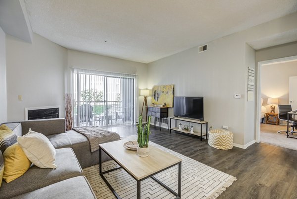 Spacious living room with modern furnishings at Union Baseline Apartments