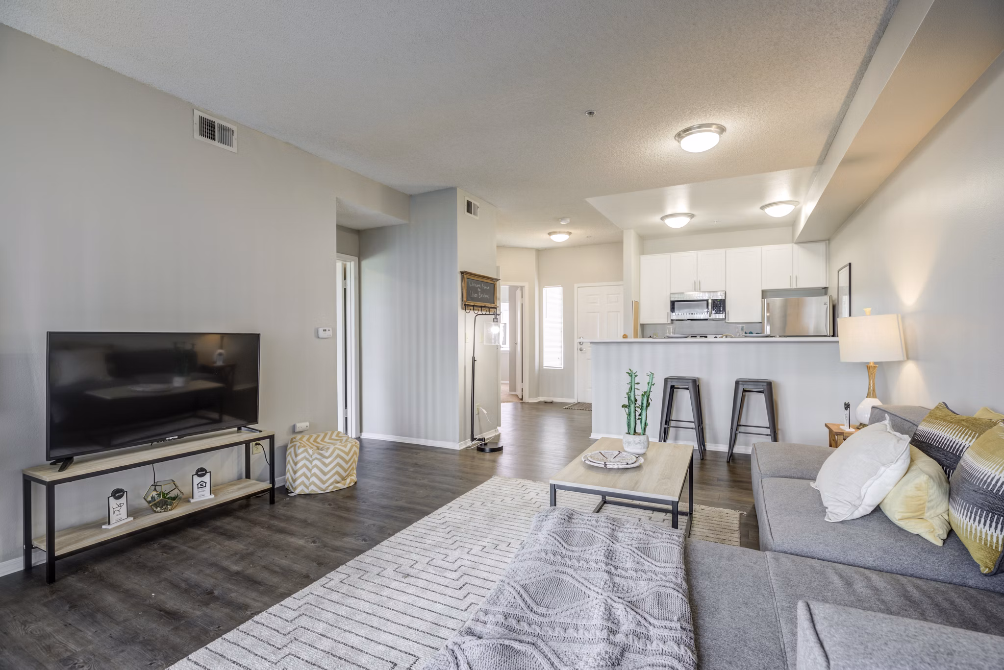 Spacious living room with contemporary decor at Union Baseline Apartments