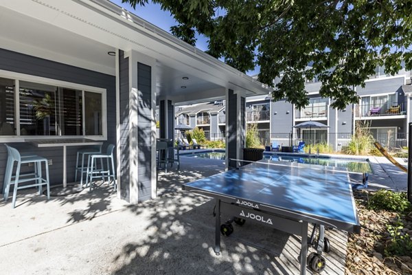 Patio with stylish seating at Union Baseline Apartments, perfect for leisure and relaxation in an upscale setting