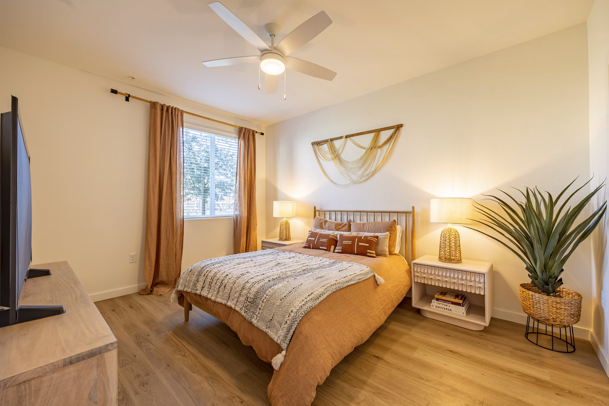 Cozy bedroom with modern decor in Alma Apartments offering luxury living