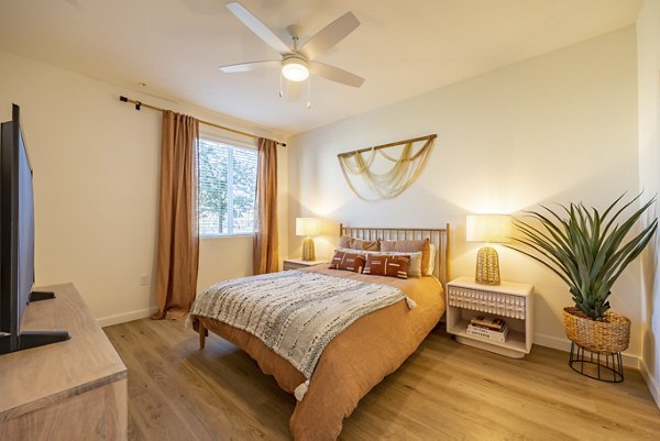 Cozy bedroom with modern decor in Alma Apartments offering luxury living