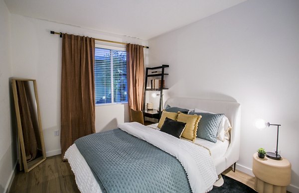 Alma Apartments: Modern bedroom with stylish decor and city views