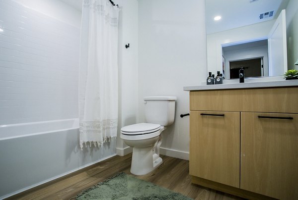 Spacious bathroom with modern fixtures at Alma Apartments