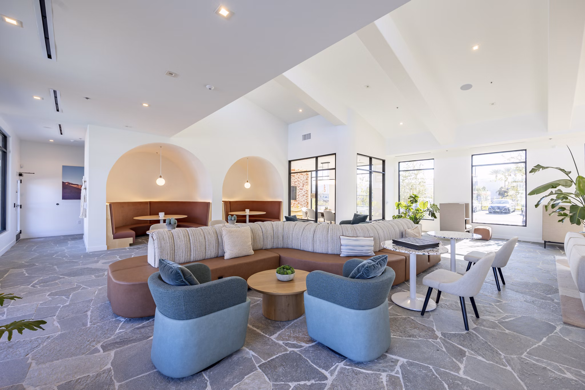 Clubhouse featuring modern design and cozy seating at Alma Apartments