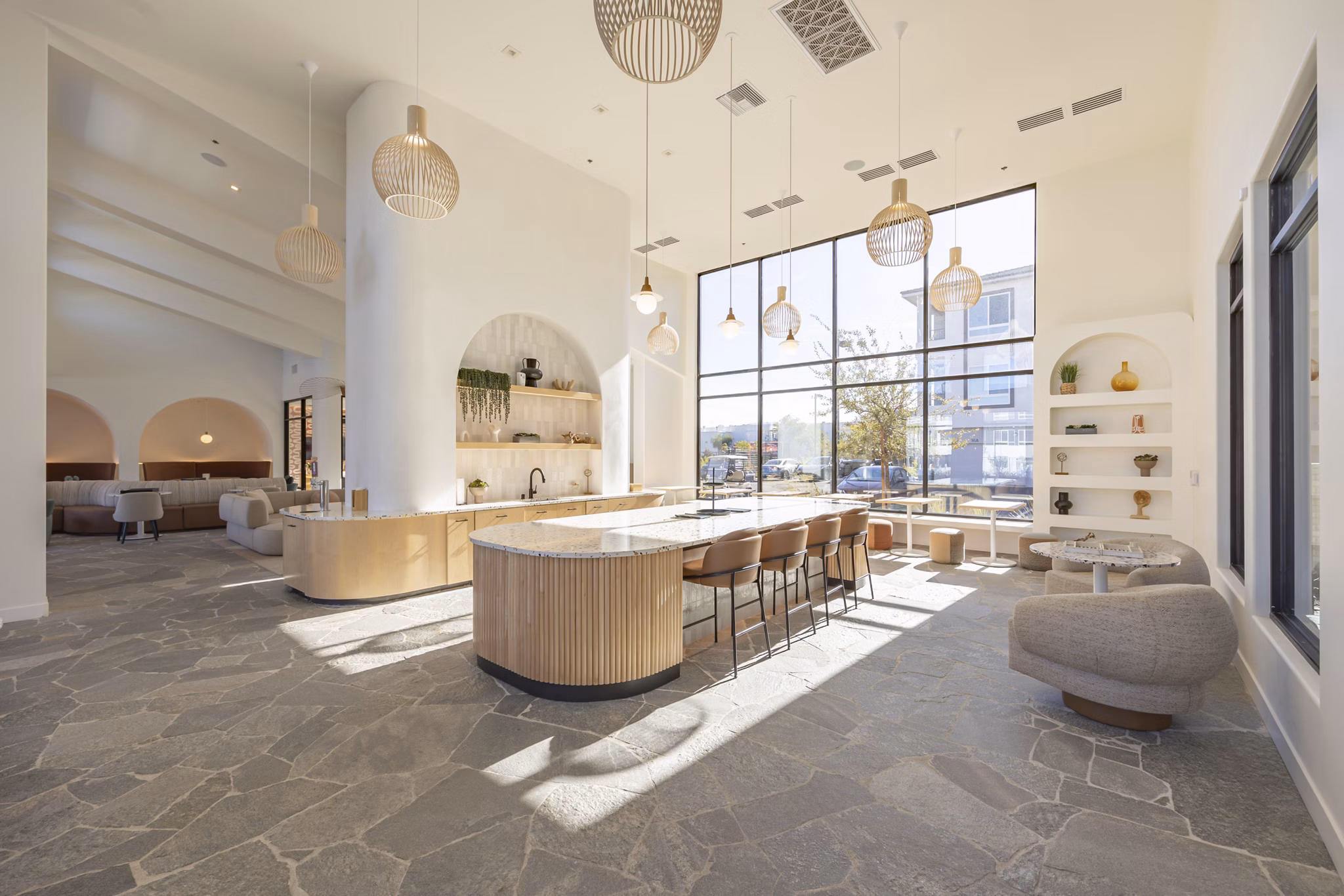 Modern clubhouse with cozy seating and community areas at Alma Apartments