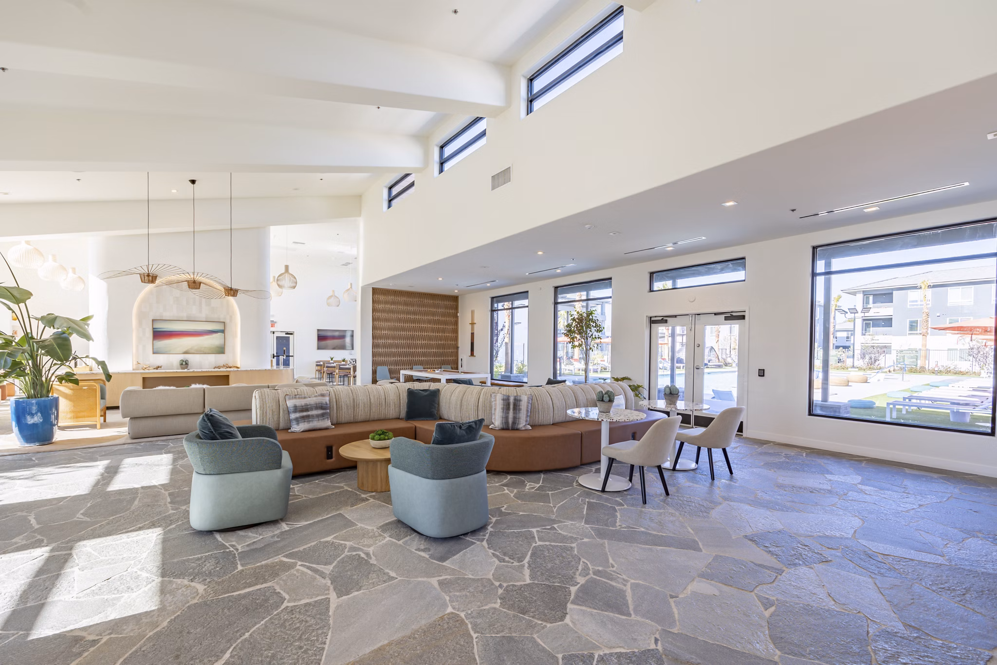 Modern clubhouse with stylish seating and vibrant decor at Alma Apartments