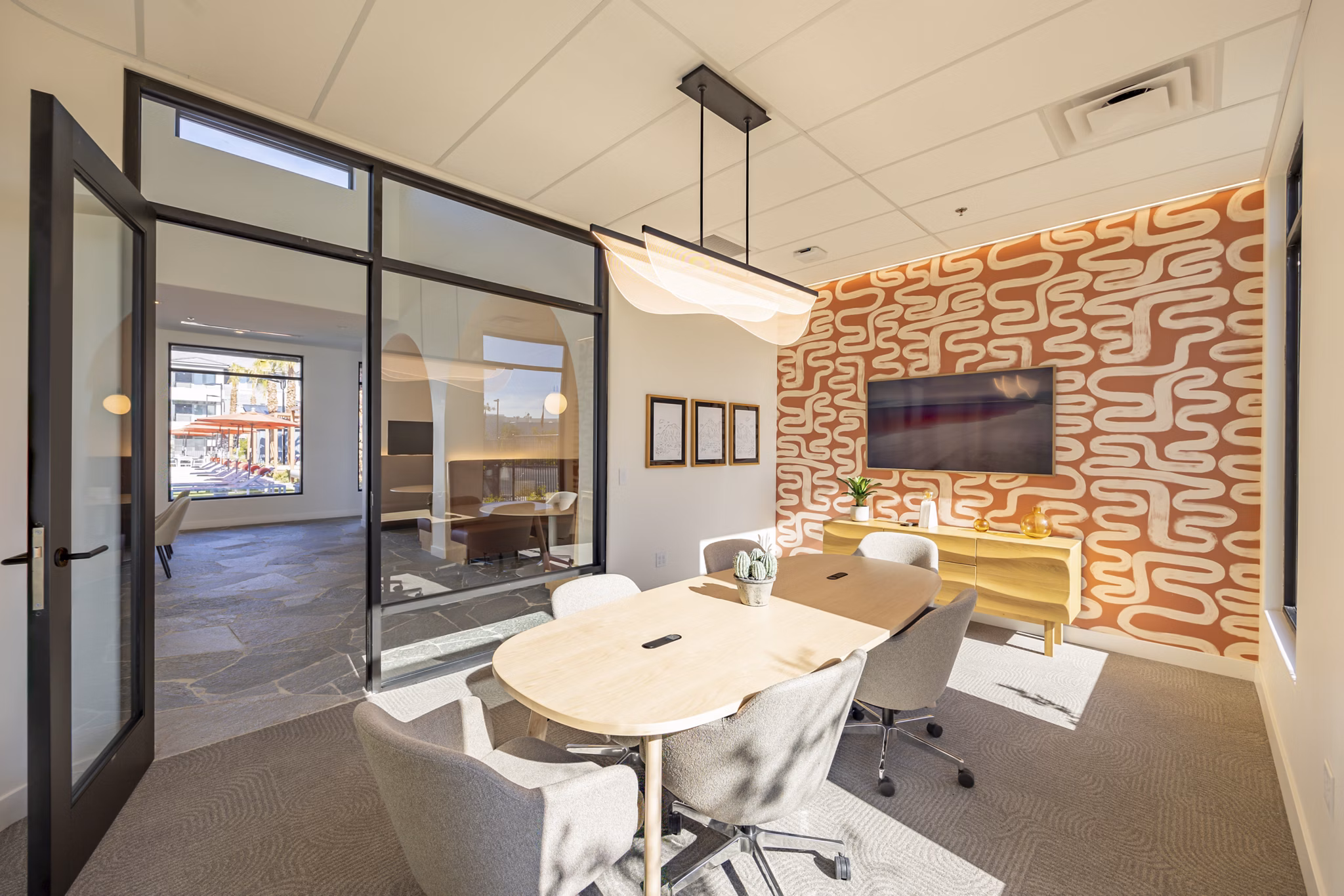 Meeting facility featuring contemporary design at Alma Apartments, ideal for business gatherings and collaborative workspaces