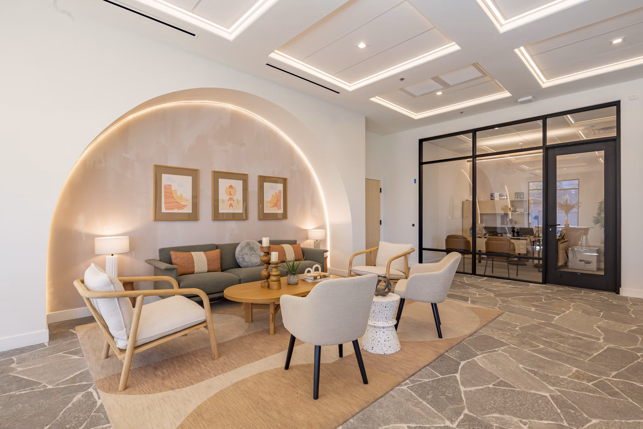 Clubhouse featuring modern design and seating areas at Alma Apartments