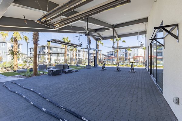 State-of-the-art fitness center featuring modern equipment at Alma Apartments