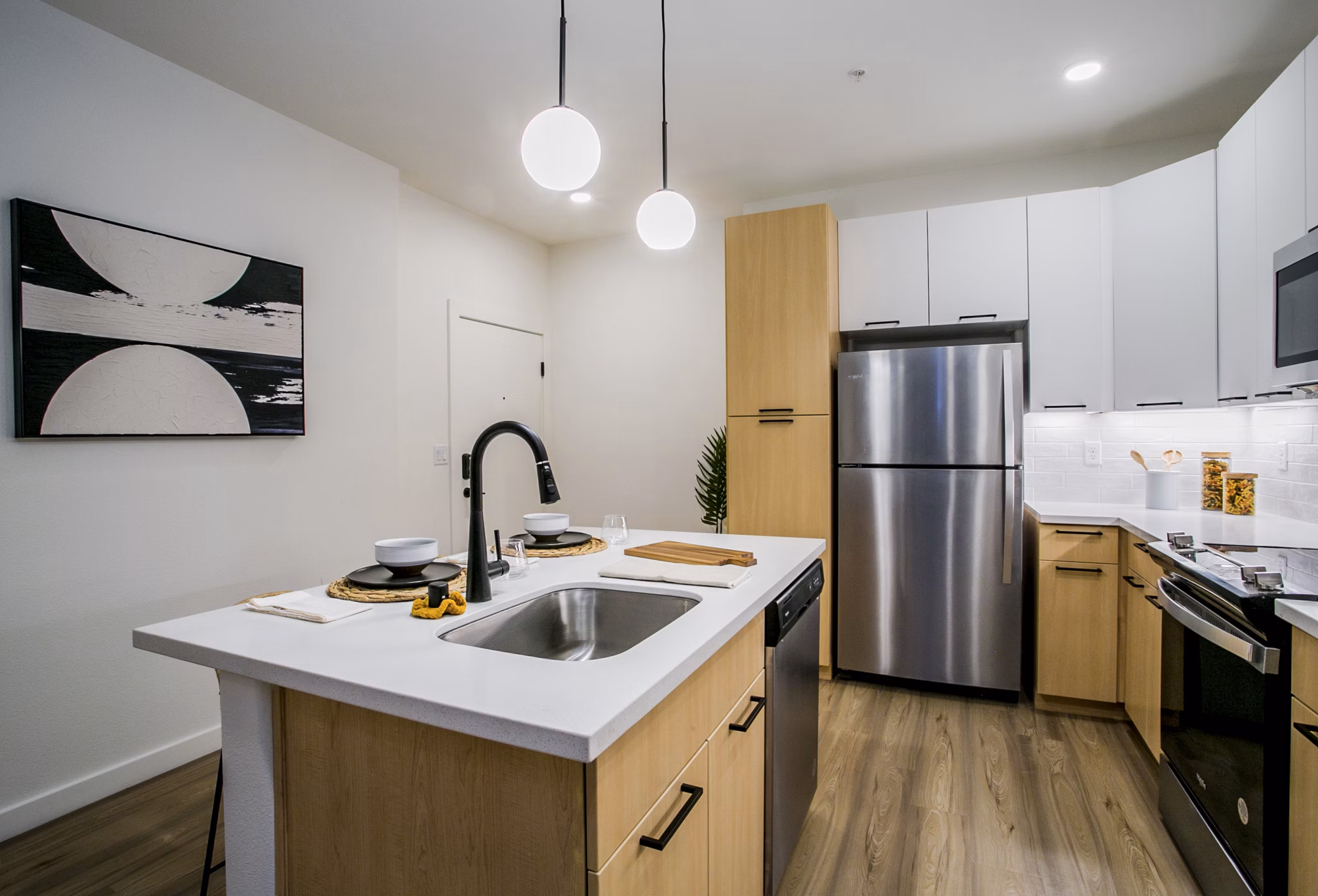 Spacious kitchen with modern appliances at Alma Apartments
