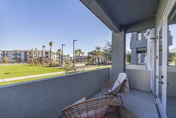 Cozy outdoor patio with stylish seating at Alma Apartments, perfect for relaxation and social gatherings