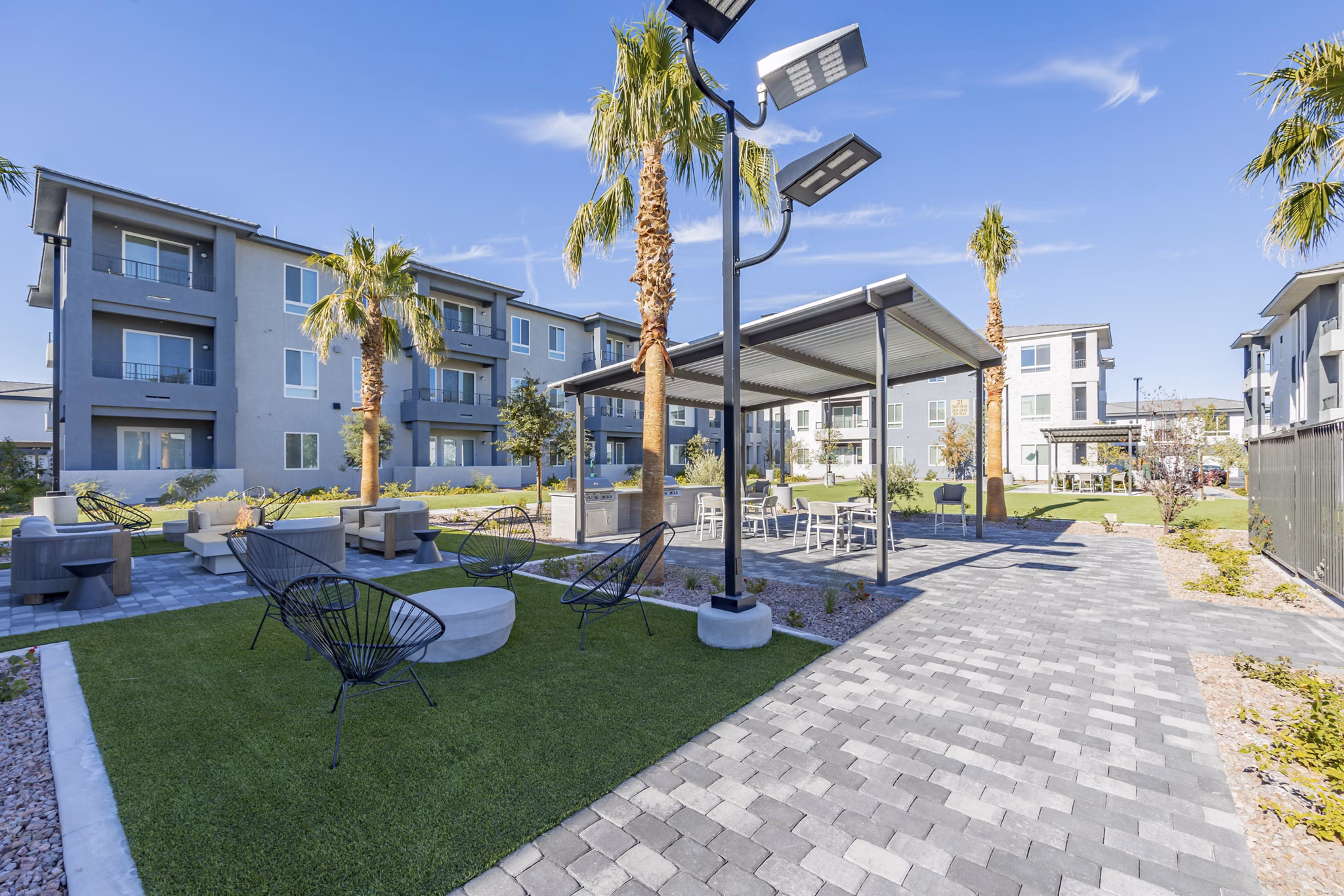 Courtyard with lush greenery at Alma Apartments, luxury living in a serene environment