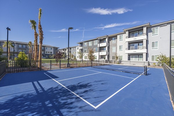 Versatile sport court at Alma Apartments, ideal for recreational activities and fitness enthusiasts in a vibrant community setting