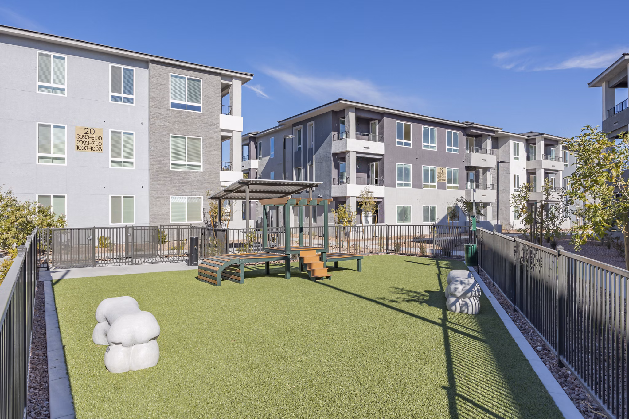 Dog-friendly park with agility equipment at Alma Apartments