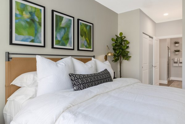 Cozy bedroom with modern decor at The Cynwyd Apartments