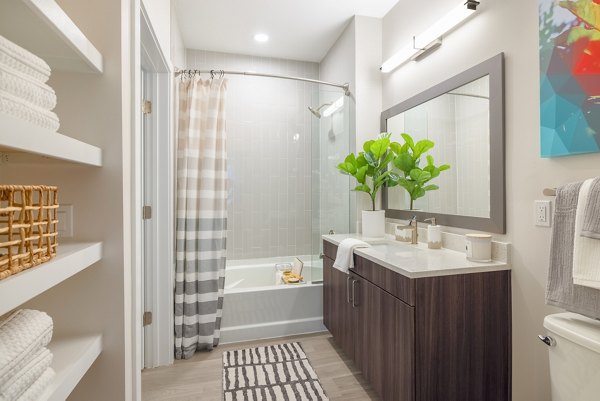 Modern bathroom with sleek fixtures at The Cynwyd Apartments, offering luxury living in a stylish Greystar community