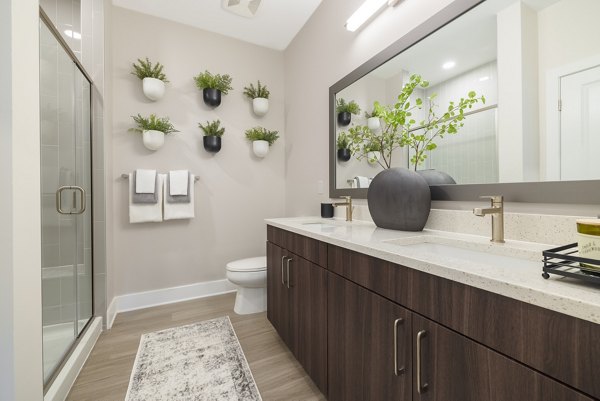 Modern bathroom with sleek fixtures at The Cynwyd Apartments, offering luxury living experiences in sophisticated spaces