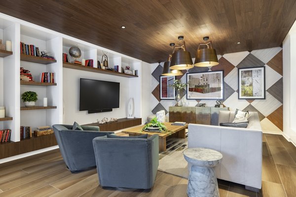 Modern clubhouse with chic seating and billiards at The Cynwyd Apartments, ideal for socializing and relaxation