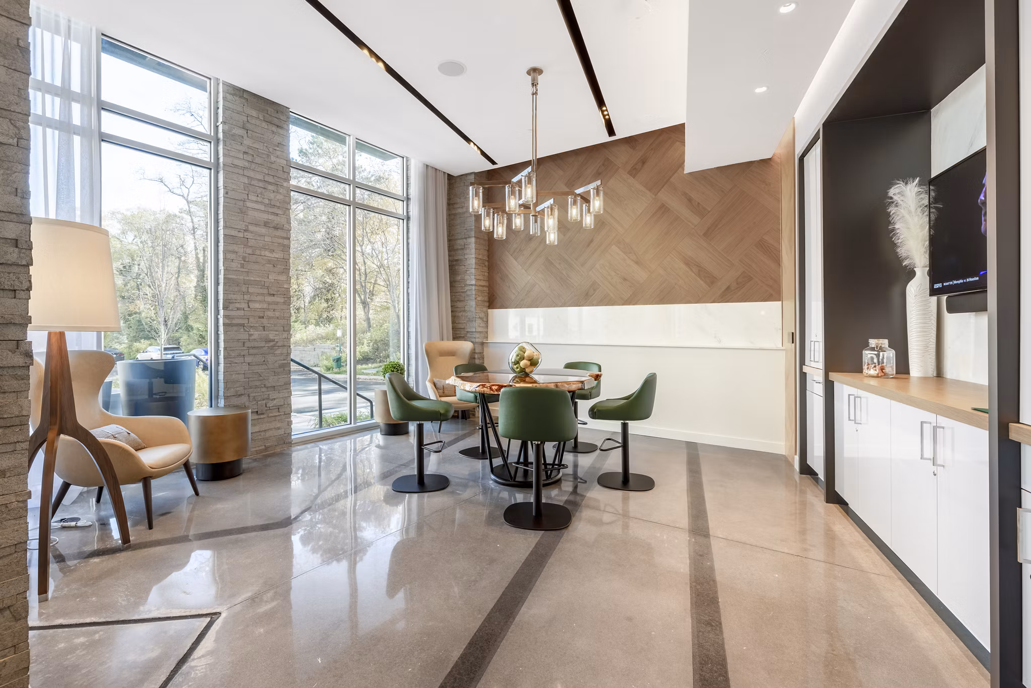 Elegant clubhouse with modern seating and artwork at The Cynwyd Apartments