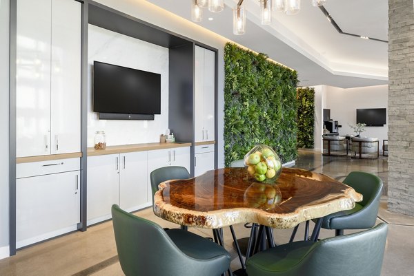 Luxury clubhouse with modern decor at The Cynwyd Apartments, ideal for social gatherings and resident events