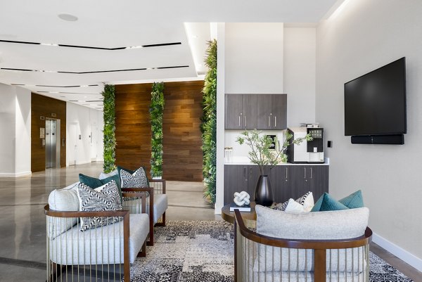 Modern clubhouse with game area and lounge at The Cynwyd Apartments