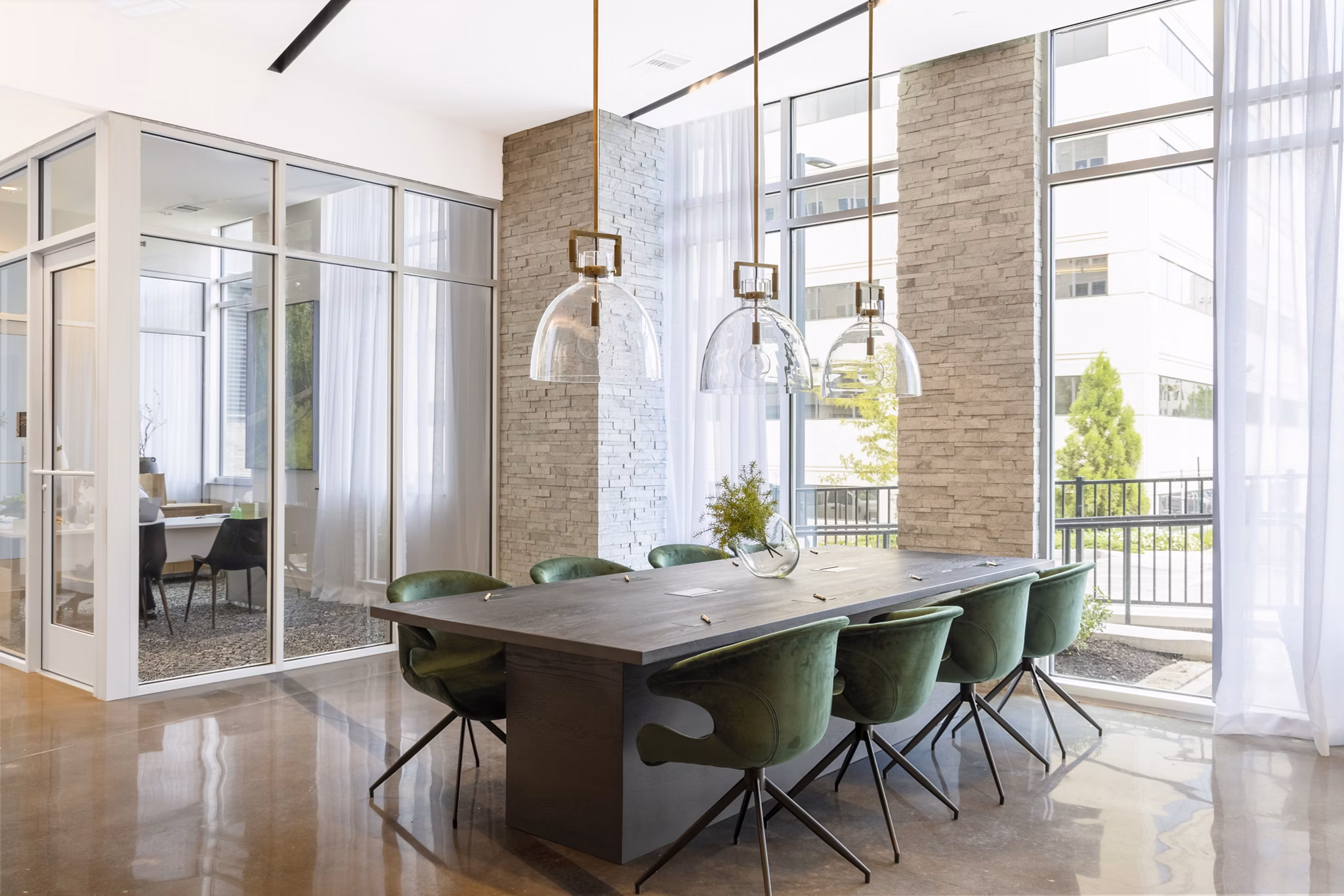 Modern clubhouse with communal seating at The Cynwyd Apartments, offering luxury amenities and social spaces for residents