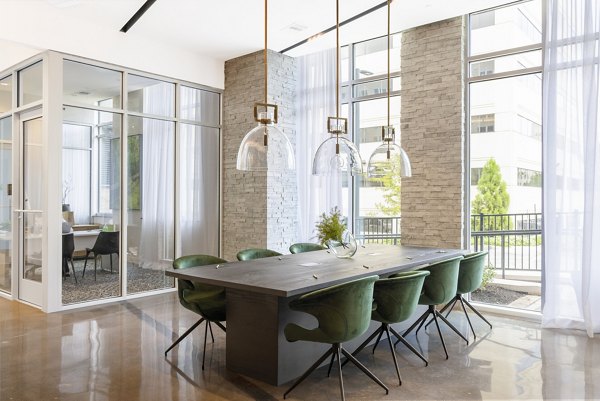 Modern clubhouse with communal seating at The Cynwyd Apartments, offering luxury amenities and social spaces for residents