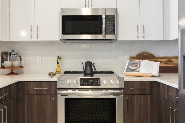 Modern kitchen with stainless steel appliances at The Cynwyd Apartments
