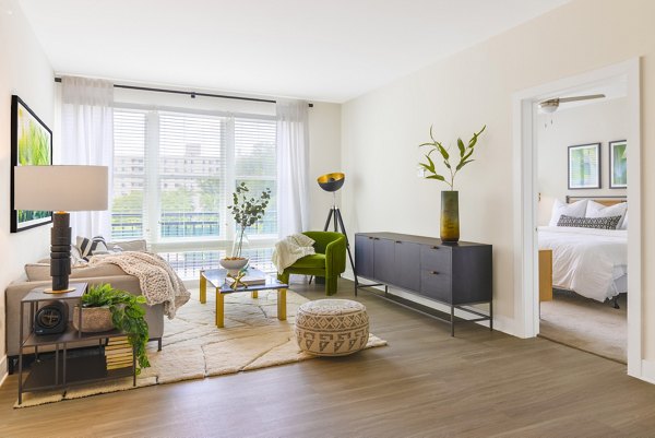 Spacious living room with modern furnishings at The Cynwyd Apartments featuring luxury design elements