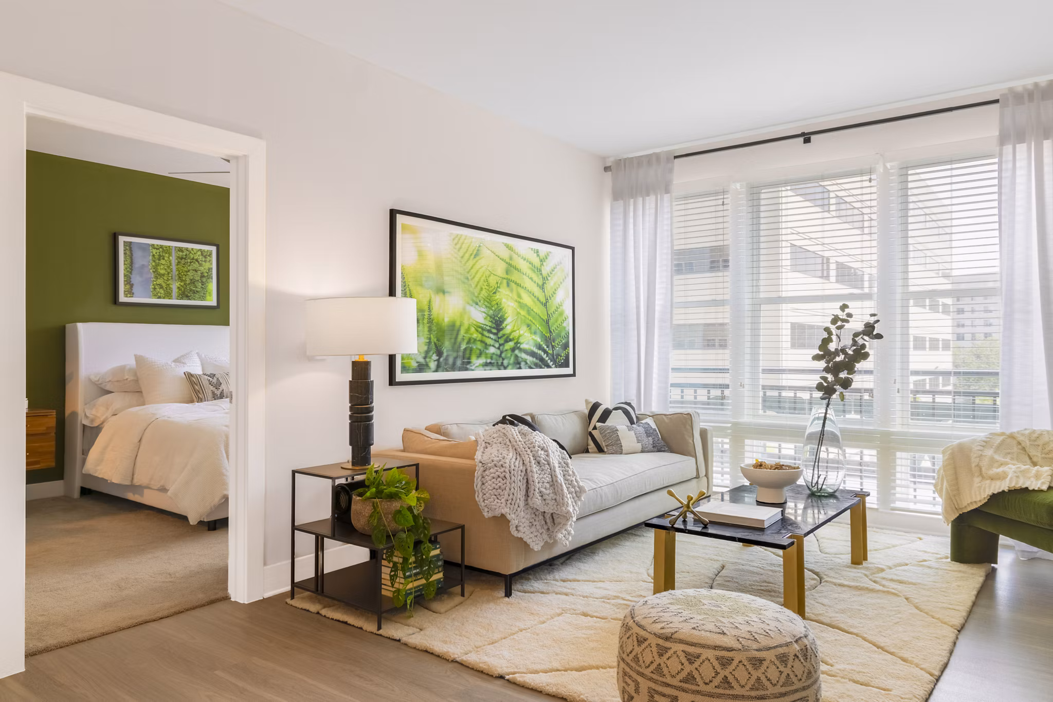 Spacious living room with modern decor and large windows in The Cynwyd Apartments, luxury living near Philadelphia