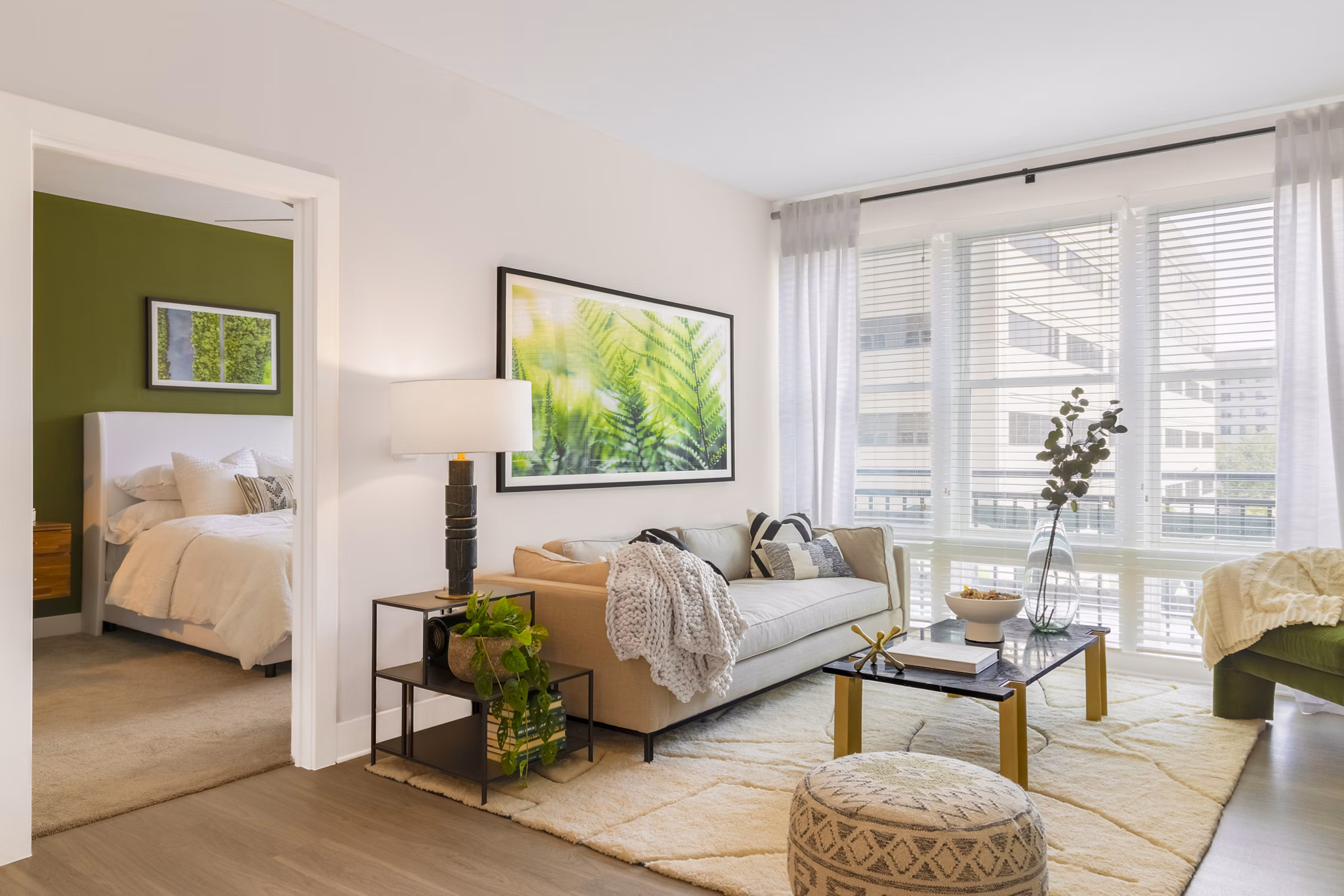 Spacious living room with modern decor and large windows in The Cynwyd Apartments, luxury living near Philadelphia