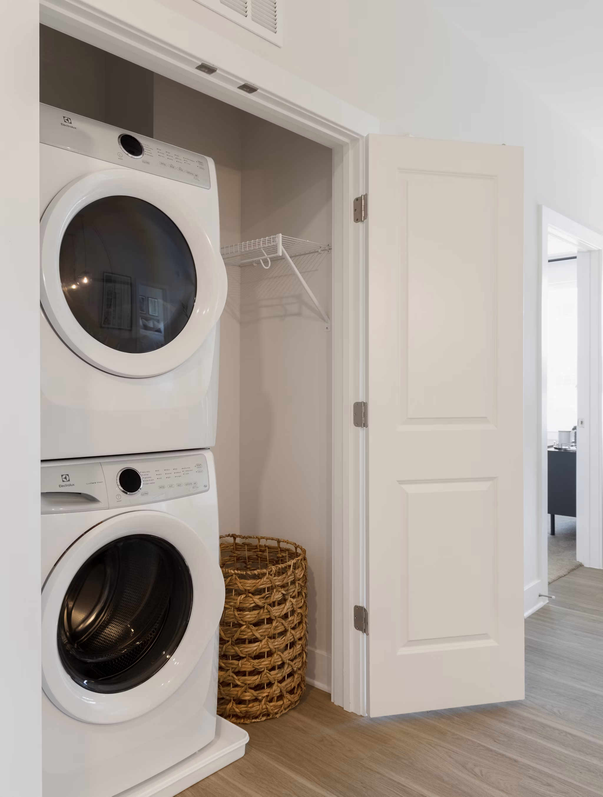 Laundry room with high-efficiency machines at The Cynwyd Apartments, a Greystar luxury community offering modern amenities