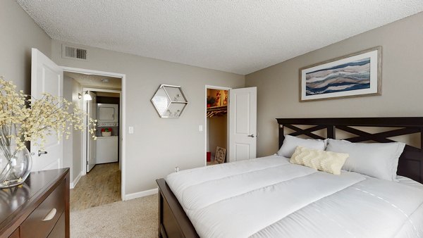 Modern bedroom with elegant decor at Glen at the Park Apartments