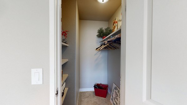 Spacious walk-in closet with organized shelving at Glen at the Park Apartments in luxury home